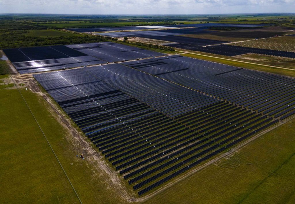 Solar panels fill fields. Bitcoin miners, renewable energy, asset-based lenders.
